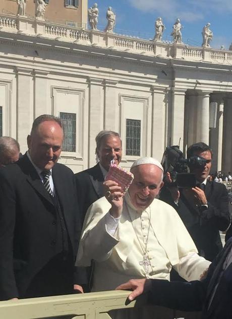 Pope Francis holds up a potholder made by 9-year-old Megan Naughton of Hingham. Courtesy of the Naughton family.